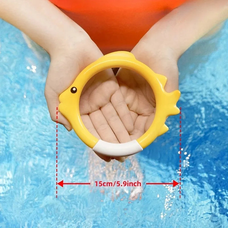 Child holding a fish-shaped diving ring