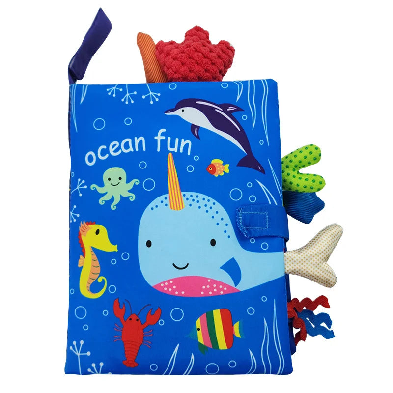 Baby cloth activity book with crinkle pages and rattle